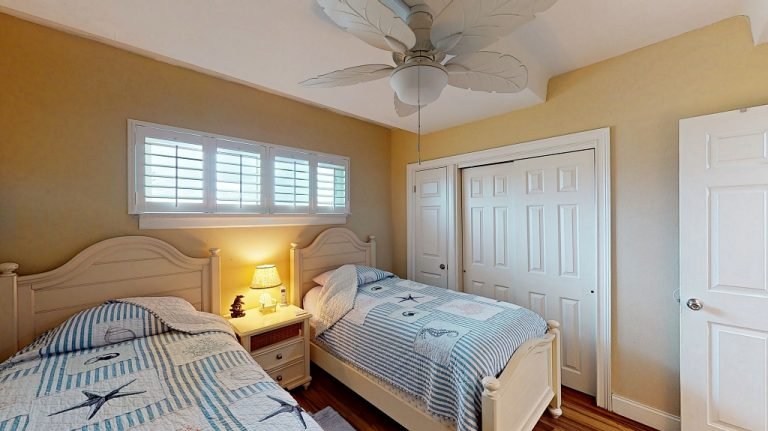 Second bedroom with two twin beds at Ocean Club South condo, sleeps 6