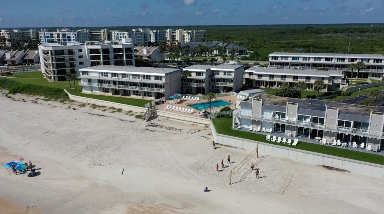 Ocean Club South oceanfront condo building and pool viewed from the no-drive beach